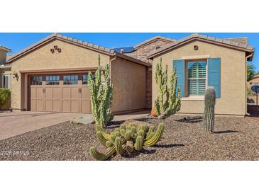 Single-story home with desert landscaping and two-car garage at 12952 W Eagle Ridge Ln, Peoria, AZ 85383