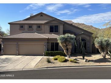 Two-story house with three-car garage and desert landscaping at 3652 N Sonoran Hts, Mesa, AZ 85207