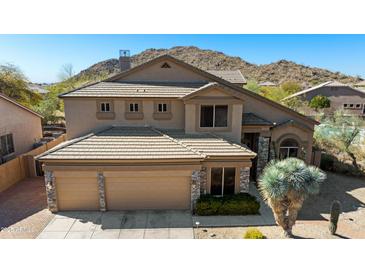 Inviting two-story home featuring a three-car garage and well-maintained landscaping at 3652 N Sonoran Hts, Mesa, AZ 85207