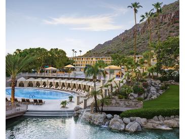 Luxury resort-style pool with private cabanas and mountain views at 6000 E Camelback Rd # 7707, Scottsdale, AZ 85251