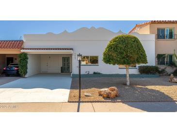 Charming single-story home with well-manicured landscaping at 7663 E Coolidge St, Scottsdale, AZ 85251