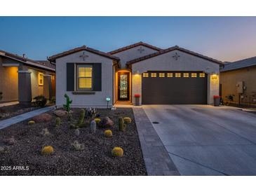 Single-story home with desert landscaping, two-car garage, and neutral exterior at 12493 E Pivot Peak --, Gold Canyon, AZ 85118