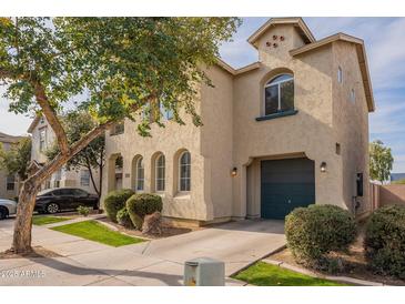 Two-story house with a garage and landscaping at 402 N 66Th Ln, Phoenix, AZ 85043
