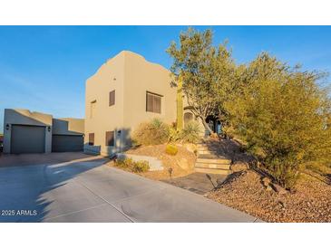 Two-story home with attached garage and desert landscaping at 15302 E Lotus Ln, Fountain Hills, AZ 85268