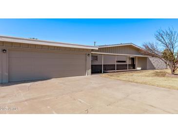 Ranch style home with attached two-car garage and carport at 530 N Miller St, Mesa, AZ 85203