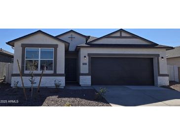 One-story home with a two-car garage and neutral color scheme at 5469 E Rock Bush Ln, San Tan Valley, AZ 85140