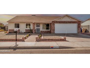 Charming single-story home with brick accents, desert landscaping, and a welcoming entrance at 5603 W Bluefield Ave, Glendale, AZ 85308