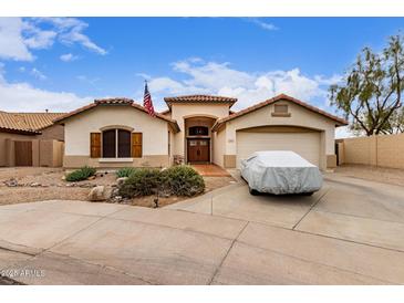 Charming single-story home featuring an attached garage, desert landscaping, and inviting curb appeal at 22415 N 34Th Ln, Phoenix, AZ 85027