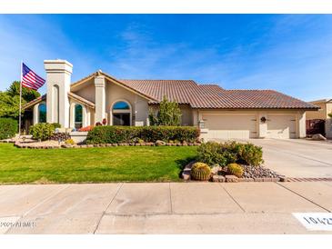 Beautiful home with landscaped yard, two-car garage, and desert landscaping at 10425 N 23Rd St, Phoenix, AZ 85028