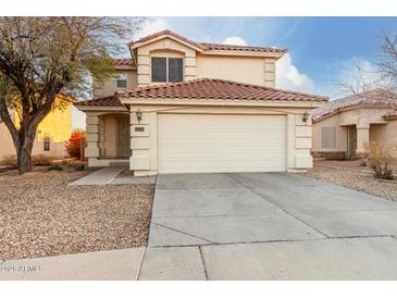 Two-story house with a two-car garage and desert landscaping at 12833 W Laurel Ln, El Mirage, AZ 85335