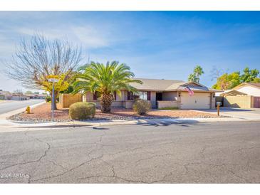 Charming single-story home boasts brick accents, mature landscaping, and a welcoming curb appeal at 16302 N 36Th Ave, Phoenix, AZ 85053