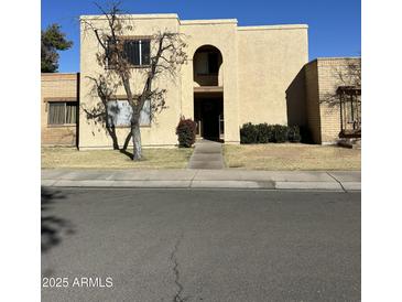 Two-story building exterior with landscaping and parking at 2130 E Dunbar Dr, Tempe, AZ 85282