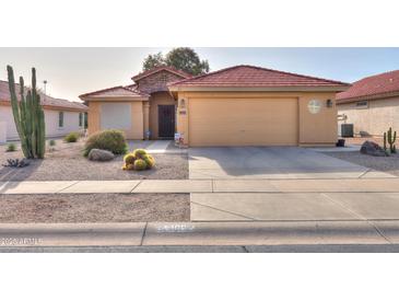 One-story house with desert landscaping and a two-car garage at 2409 E Antigua Dr, Casa Grande, AZ 85194