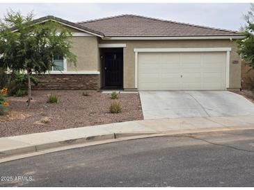 One-story house with attached garage and desert landscaping at 3014 N Majestic Ct, Casa Grande, AZ 85122