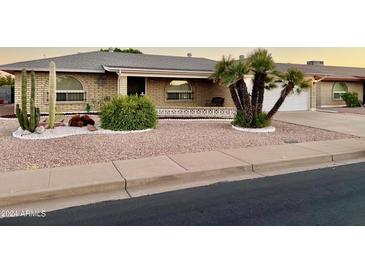 Ranch-style home with desert landscaping and a two-car garage at 4725 E Capri Ave, Mesa, AZ 85206