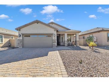 Single-story home with a two-car garage and desert landscaping at 789 E Blossom Rd, San Tan Valley, AZ 85143