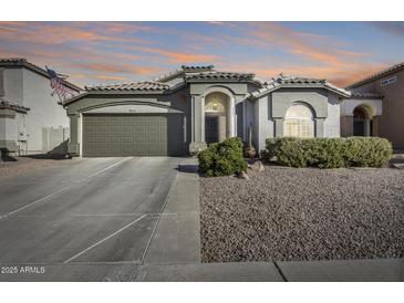 One story home with landscaped yard and two car garage at 937 N Kingston St, Gilbert, AZ 85233