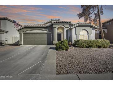 Beautiful single-story home with a landscaped front yard and attached two-car garage at 937 N Kingston St, Gilbert, AZ 85233