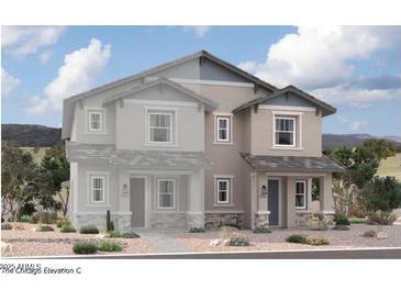 Two-story stucco home with grey roof and landscaping at 2828 N Evergreen St, Buckeye, AZ 85396