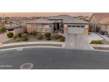 Single-story home with a two-car garage and well-maintained landscaping at 21622 E Via De Arboles --, Queen Creek, AZ 85142