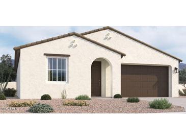 New single-story home with a two-car garage and attractive landscaping at 37749 N Cowboy Ln, San Tan Valley, AZ 85140