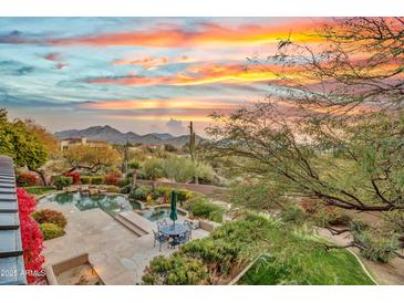 Stunning sunset view overlooking a private pool and patio area, perfect for entertaining at 10040 E Happy Valley Rd # 595, Scottsdale, AZ 85255