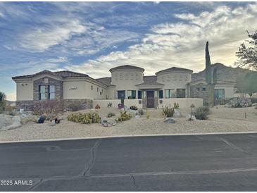 Stunning single-story home with desert landscaping, mountain views and unique architectural design at 11429 S Wilson Ln, Goodyear, AZ 85338