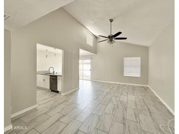 Bright living room with tile floors and ceiling fan at 1342 W Emerald Ave # 344, Mesa, AZ 85202