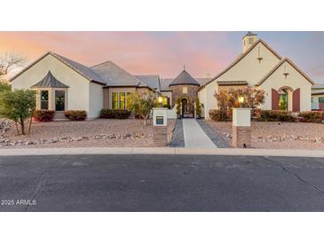 Stunning two-story home with a brick facade and manicured landscaping at 2706 E Lovebird Ln, Gilbert, AZ 85297