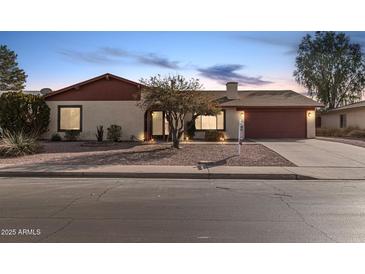 Single-story home with red-tiled roof and attached garage at 753 W Pampa Ave, Mesa, AZ 85210