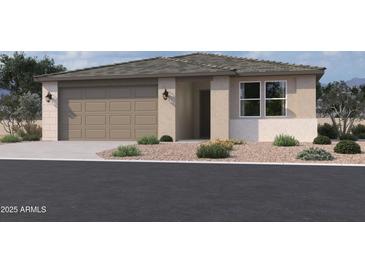 One-story home with neutral exterior and a two-car garage at 9526 W Luxton Ln, Tolleson, AZ 85353