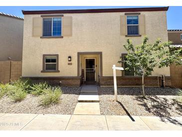 Charming two-story home featuring a welcoming front yard and neutral-toned exterior at 3937 S 79Th Ln, Phoenix, AZ 85043