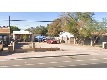 Vacant lot with neighboring houses and street parking at 9226 S Avenida Del Yaqui --, Guadalupe, AZ 85283