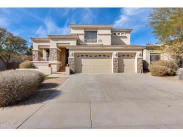 Two-story house with three-car garage and desert landscaping at 22432 N 48Th St, Phoenix, AZ 85054