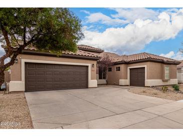 Two-car garage and attractive desert landscaping enhance this home's curb appeal at 2702 S Joplin --, Mesa, AZ 85209