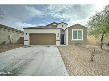 Charming single-story home with a two-car garage and low maintenance desert landscaping at 30263 W Pinchot Ave, Buckeye, AZ 85396