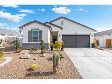 One-story home with desert landscaping and two-car garage at 3560 N Mia Ln, Casa Grande, AZ 85122