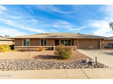 Single story home with desert landscaping and two car garage at 16033 N 110Th Ave, Sun City, AZ 85351