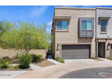 Modern two-story home with attached garage and desert landscaping at 23393 N 73Rd Way, Scottsdale, AZ 85255