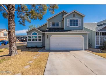 Charming two-story home with attached two-car garage and nicely maintained front yard at 235 N 22Nd Pl # 565, Mesa, AZ 85213