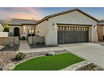 Single-story home with a two-car garage and landscaped front yard at 28107 N 123Rd Ln, Peoria, AZ 85383