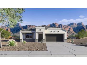 Charming single-story home with desert landscaping and a two-car garage nestled against a backdrop of mountains at 28242 N Nealite Dr, San Tan Valley, AZ 85143