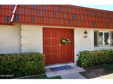 Inviting front entrance with decorative double doors and landscaping at 3928 N Granite Reef Rd, Scottsdale, AZ 85251