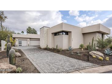 Modern home with desert landscaping and paver driveway at 7153 E Ironwood Dr, Paradise Valley, AZ 85253