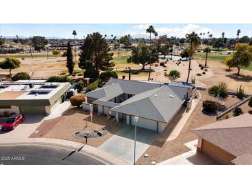 Aerial view of single-story home with golf course views at 10377 W White Mountain Rd, Sun City, AZ 85351