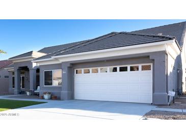 Two-car garage and front entryway of a single story home at 13709 W Gunsight Dr, Sun City West, AZ 85375