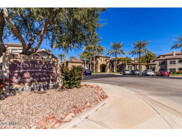 Mountain Canyon Condominium Residences building with parking lot and landscaping at 3236 E Chandler Blvd # 2053, Phoenix, AZ 85048