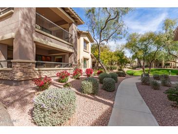 Attractive exterior of a two-story building with landscaping and walkways at 21320 N 56Th St # 1119, Phoenix, AZ 85054