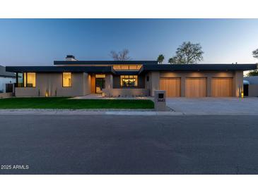 Stunning single-story home with a 3-car garage and a well-manicured front yard at 3643 E Coolidge St, Phoenix, AZ 85018