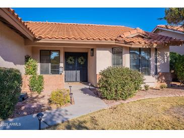 Inviting home exterior with a terracotta roof and landscaped front yard at 1326 E Clearwater Ln, Gilbert, AZ 85234